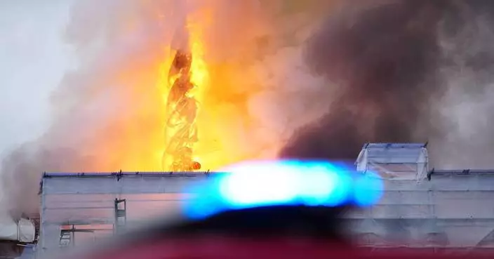 Fire destroys Copenhagen's Old Stock Exchange dating to 1600s, collapsing its dragon-tail spire