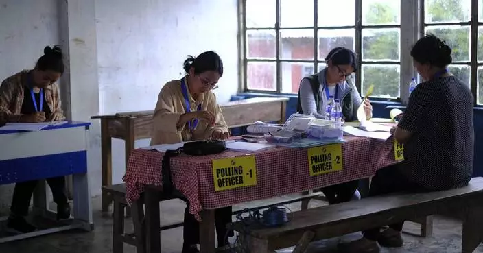 AP PHOTOS: For the world's largest democratic exercise, one village's polling officers are all women