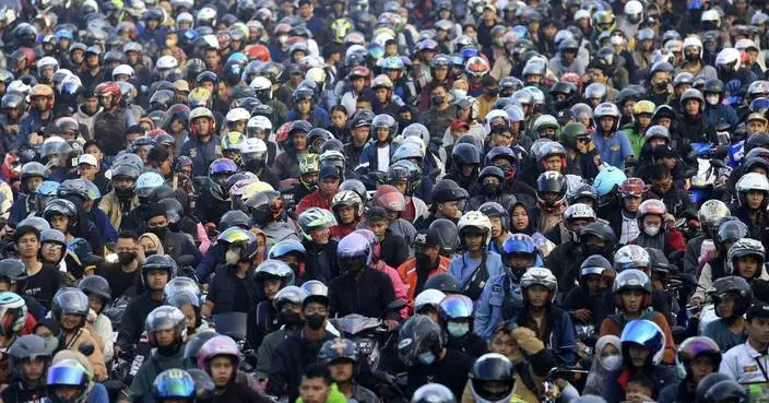 AP PHOTOS: Indonesia expects biggest-ever Eid homecoming, a mass movement of over 190 million people