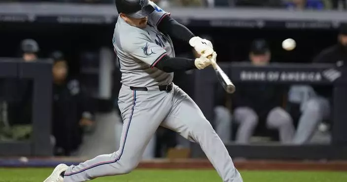 Marlins improve to 2-11 as Burger hits 3-run homer in 5-2 win over Yankees