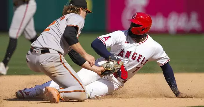 Orioles hold off Angels by throwing out base stealer. Trout becomes 1st in majors to reach 10 homers