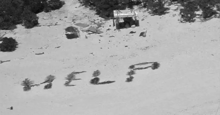 &#8216;HELP&#8217; sign on beach points rescuers to men stuck nine days on remote Pacific atoll