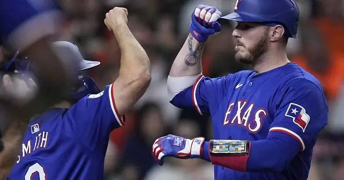 Heim homers with 4 RBIs as Rangers win 12-8 and drop Astros to to 4-11