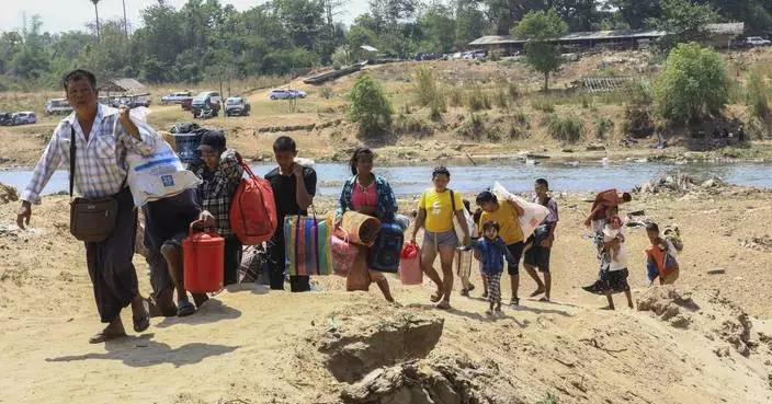 About 1,300 people from Myanmar flee into Thailand after clashes broke out in a key border town