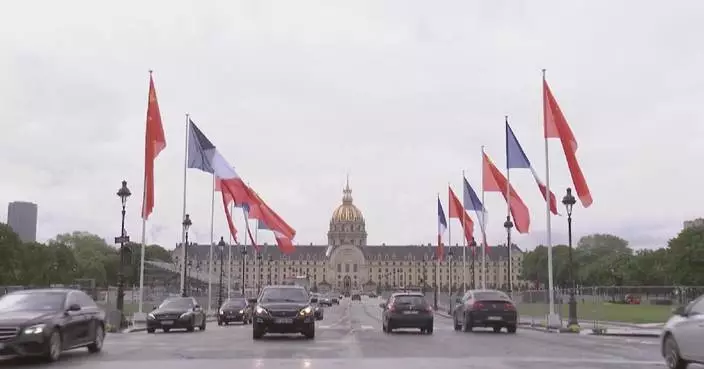 Chinese, French national flags flying in Paris for Xi's visit