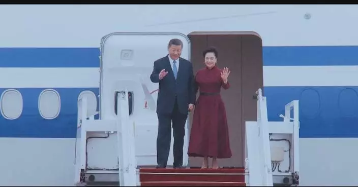 Xi arrives in Paris for state visit to France, receiving warm welcome