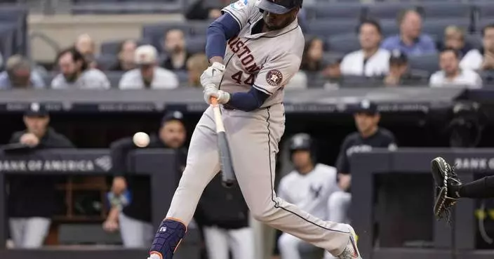 Alvarez and Singleton hit long homers in the 1st inning to help Astros avoid being swept by Yankees