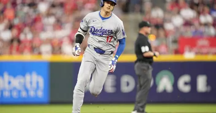 Dodgers manager Dave Roberts says star Shohei Ohtani has been slowed by a hamstring bruise