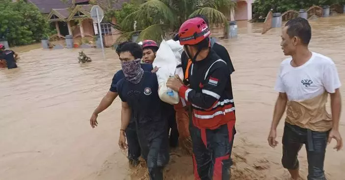 Flood and landslide hit Indonesia's Sulawesi island, killing 14