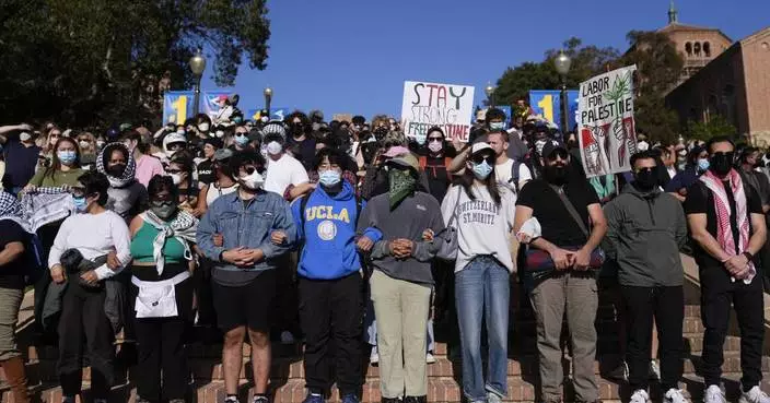 Hundreds of pro-Palestinian protesters remain  on UCLA campus despite police ordering them to leave