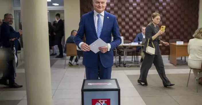 Lithuanians return to the polls with incumbent president favored to win 2nd election round