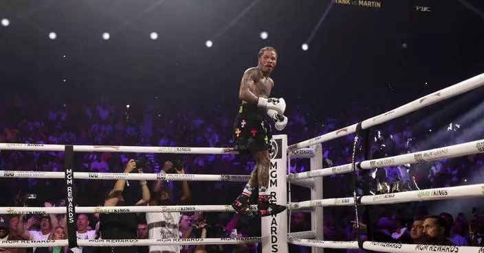 &#8216;Tank&#8217; Davis knocks out Martin in the 8th round to keep WBA lightweight title