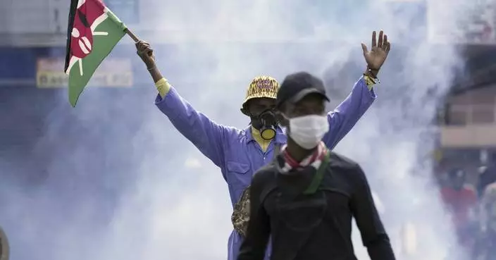 Amid heavy police presence, Kenya starts clearing debris after protests in which at least 6 died