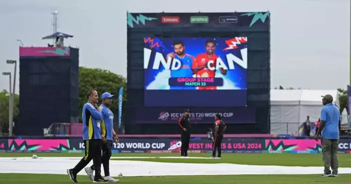 England wins rain-affected T20 World Cup match and must sweat on Scotland
