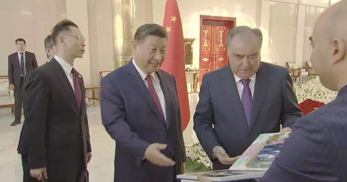 Xi receives photo album featuring three Tajikistan visits