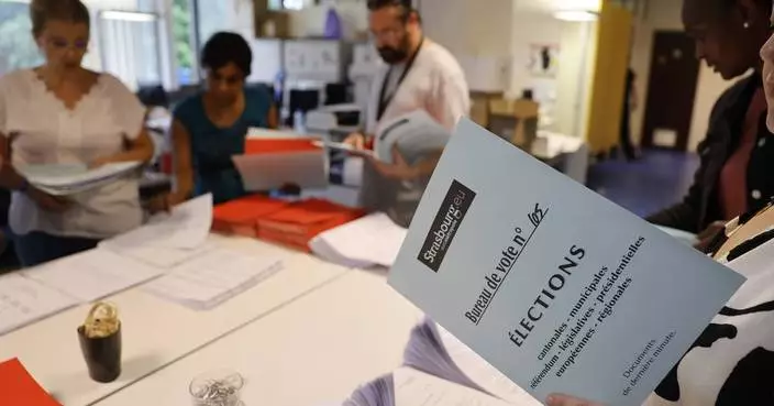 The Latest | French leftists win most seats in legislative elections