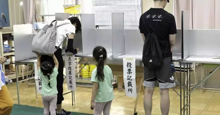 Voters in Tokyo cast ballots to decide whether to re-elect incumbent conservative as city's governor