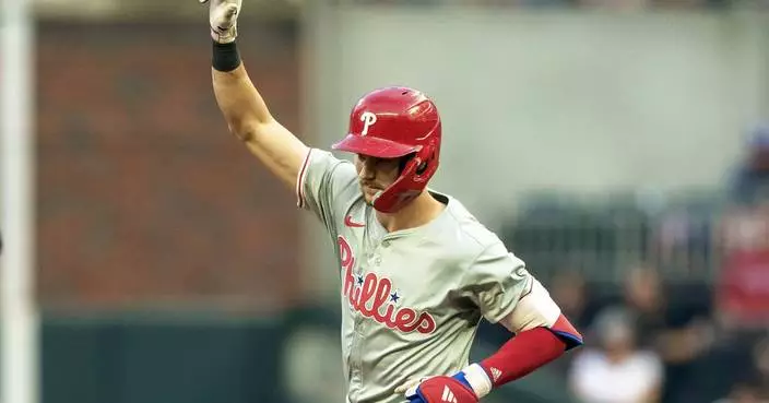 Trea Turner homers twice, Aaron Nola gets 100th career win in Phillies&#8217; 8-6 victory over Braves