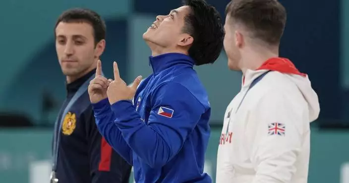 Filipino gymnast who won 2 Olympic golds in Paris gets hero&#8217;s welcome and free buffets for life