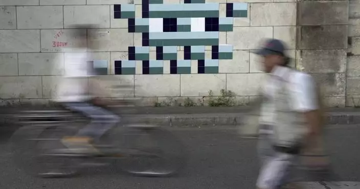 Mystery Paris street artist &#8216;Invader&#8217; glues up new work to celebrate Olympics and delight fans