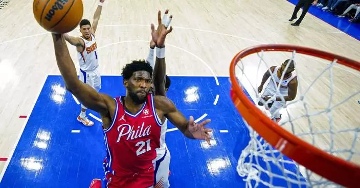 76ers star Joel Embiid honors his late brother at a Philly block party