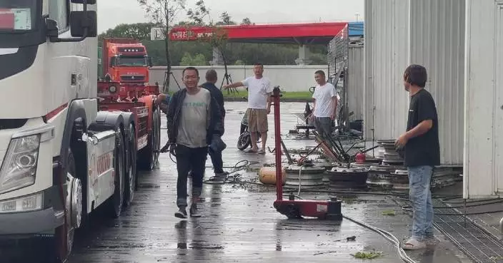 Truck drivers seek shelter as powerful typhoon hits Shanghai