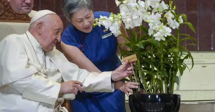 Pope marvels at Singapore's skyscrapers and asks that the lowest migrant workers not be forgotten