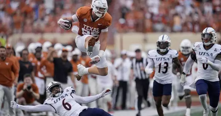 Arch Manning takes over for injured Quinn Ewers, leads No. 2 Texas to 56-7 rout of UTSA