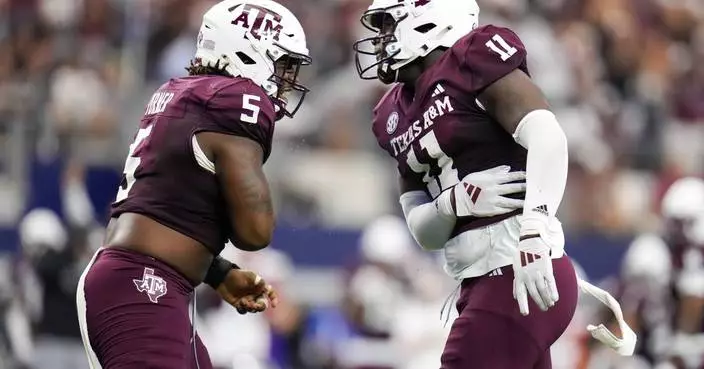 Marcel Reed throws for 2 touchdowns and runs for another in No. 24 Aggies&#8217; 21-17 win over Arkansas