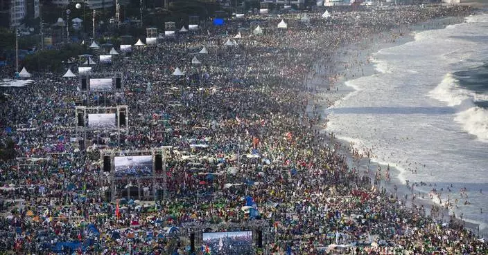 How does the huge crowd for the pope's Mass in East Timor compare to others?