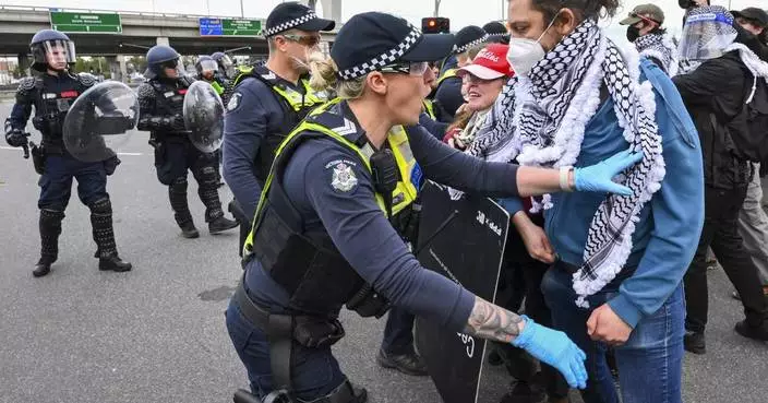 Anti-war protesters in Australia clash with police outside a weapons convention