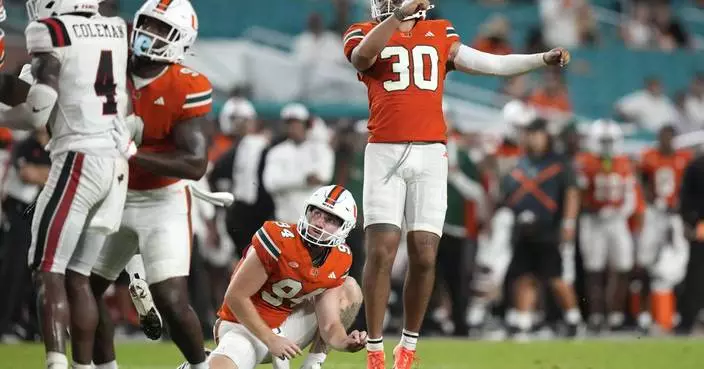 From way downtown! Twice! Virginia Tech, Miami kickers close 1st half with a field goal display