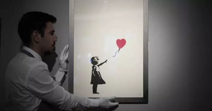 2 men charged with stealing a famous Banksy image from a London art gallery