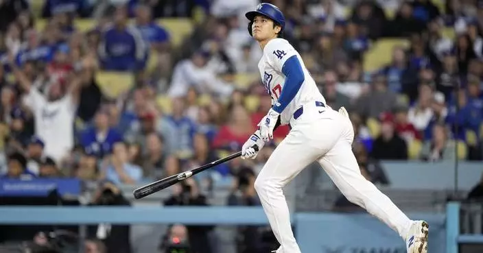 AP PHOTOS: Ohtani chases historic 50-50 club in home runs and stolen bases