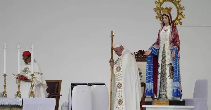 Pope heads to Papua New Guinea after final Mass in Indonesia before an overflow crowd of 100,000