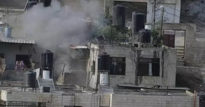 Israeli soldiers pushed three apparently lifeless bodies from roofs during a West Bank raid