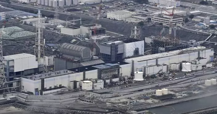 A robot begins removal of melted fuel from the Fukushima nuclear plant. It could take a century