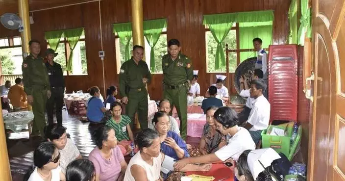 Myanmar soldiers help clean up after a typhoon that killed more than 380 people