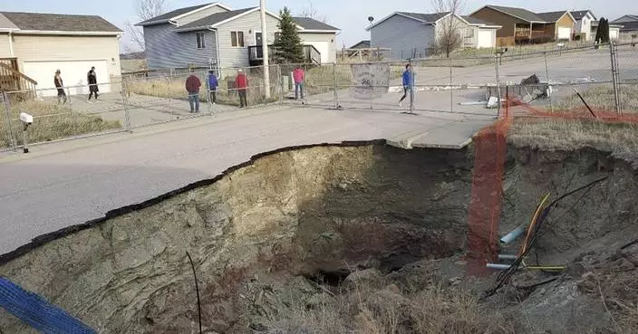 Giant sinkholes in a South Dakota neighborhood make families fear for their safety