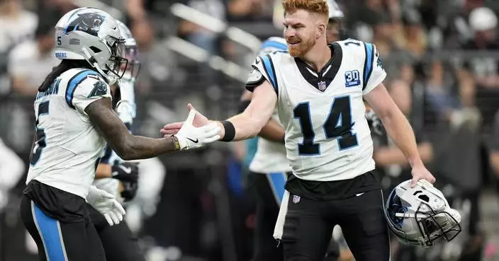 Andy Dalton passes for 319 yards and 3 TDs to lead Panthers past Raiders 36-22 for first win