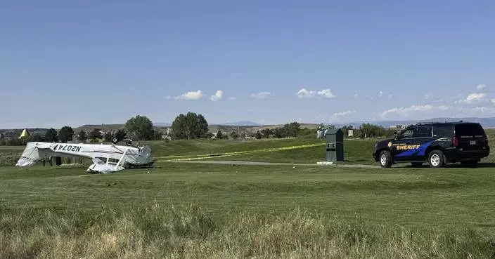 2 people walk away after a small plane crashes at a Denver-area golf course