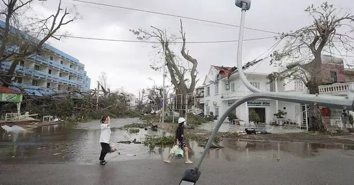 Typhoon Yagi kills 14 in Vietnam as officials warn of heavy rain that can cause flooding