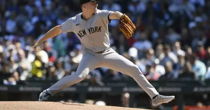 Schmidt and Cortes combine for a 4-hitter as the Yankees blank the Cubs once again