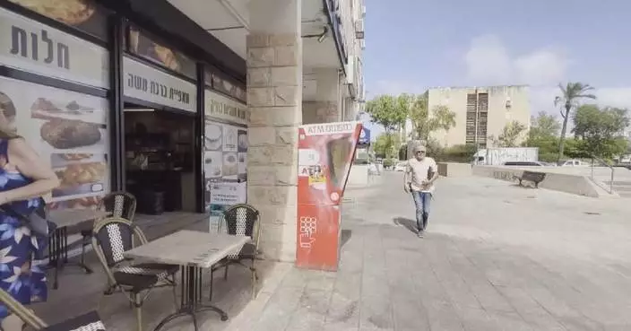 Residents seek shelter as air raid sirens sound in Haifa