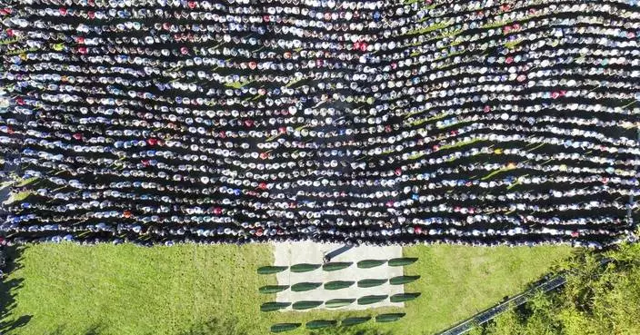 Hundreds attend a funeral service in southern Bosnia for 19 killed in devastating floods