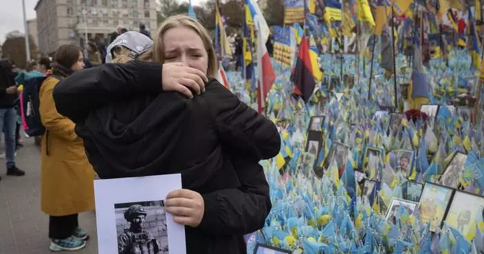 A likely Russian artillery strike kills at least 6 at a Ukrainian market