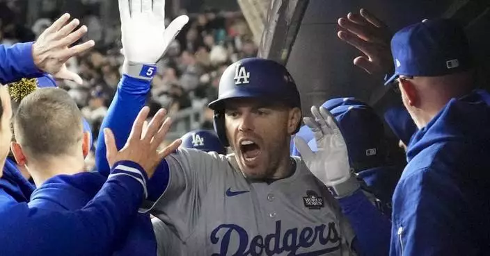 Freeman and Buehler lead Dodgers past slumping Yankees 4-2 for 3-0 advantage in World Series