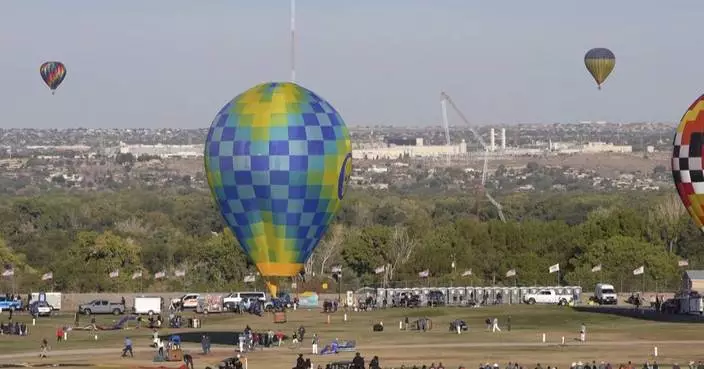 Hot-air balloon strikes and collapses radio tower in Albuquerque during festival