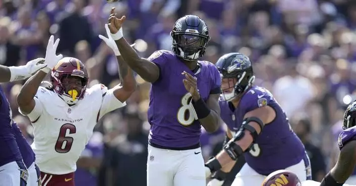 Jackson outduels Daniels and Henry runs for two TDs as Ravens beat Commanders 30-23