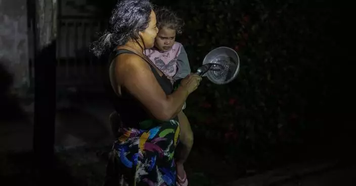 Cubans struggle with an extended power outage and a new tropical storm